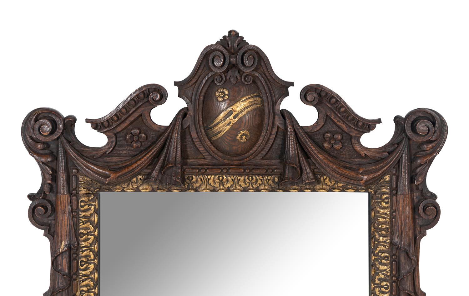 A Continental Parcel Gilt Oak Mirror
