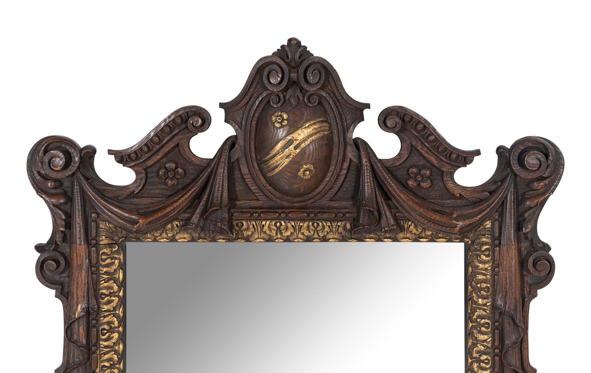A Continental Parcel Gilt Oak Mirror