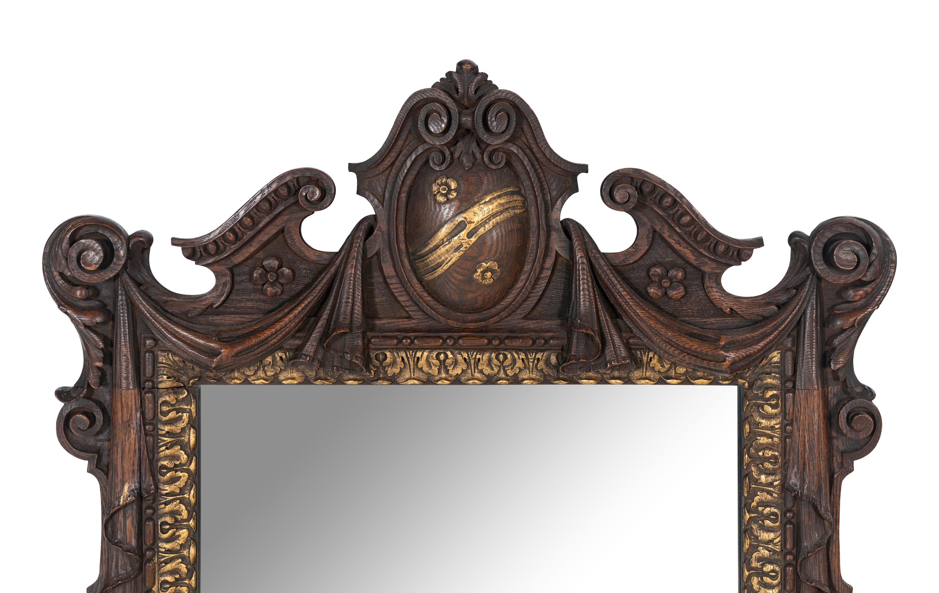 A Continental Parcel Gilt Oak Mirror