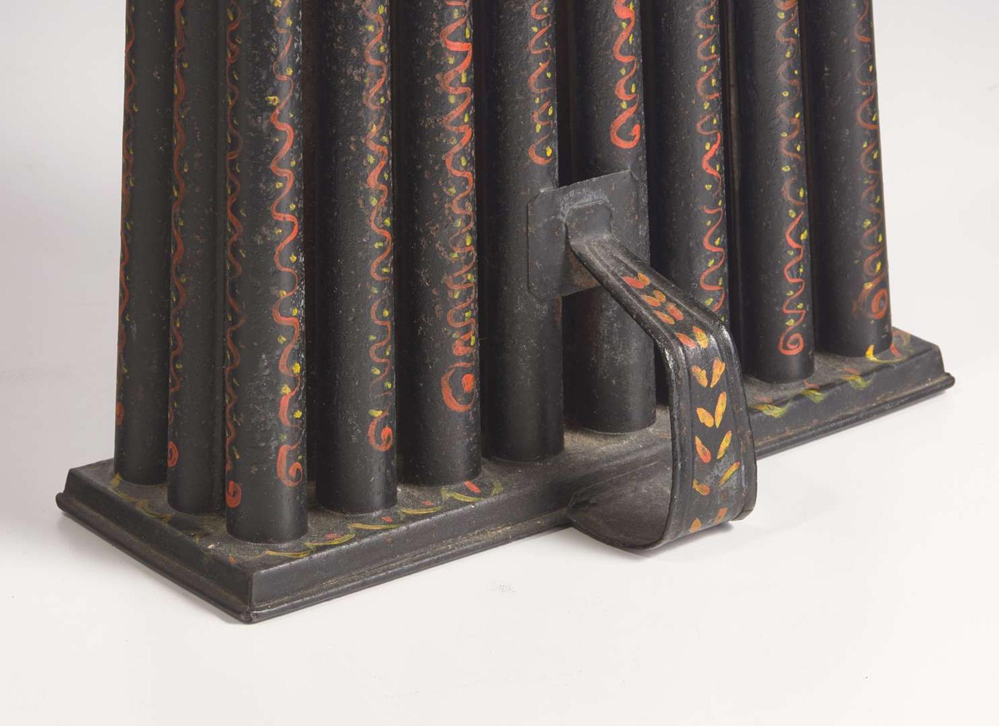 A group of five tole or painted and decorated tinware table items, probably Pennsylvania, 19th / 20th century