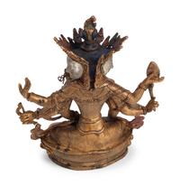 A Tibetan Style Gilt Bronze, Rock Crystal and Cabochon-Inset Figure of a Deity