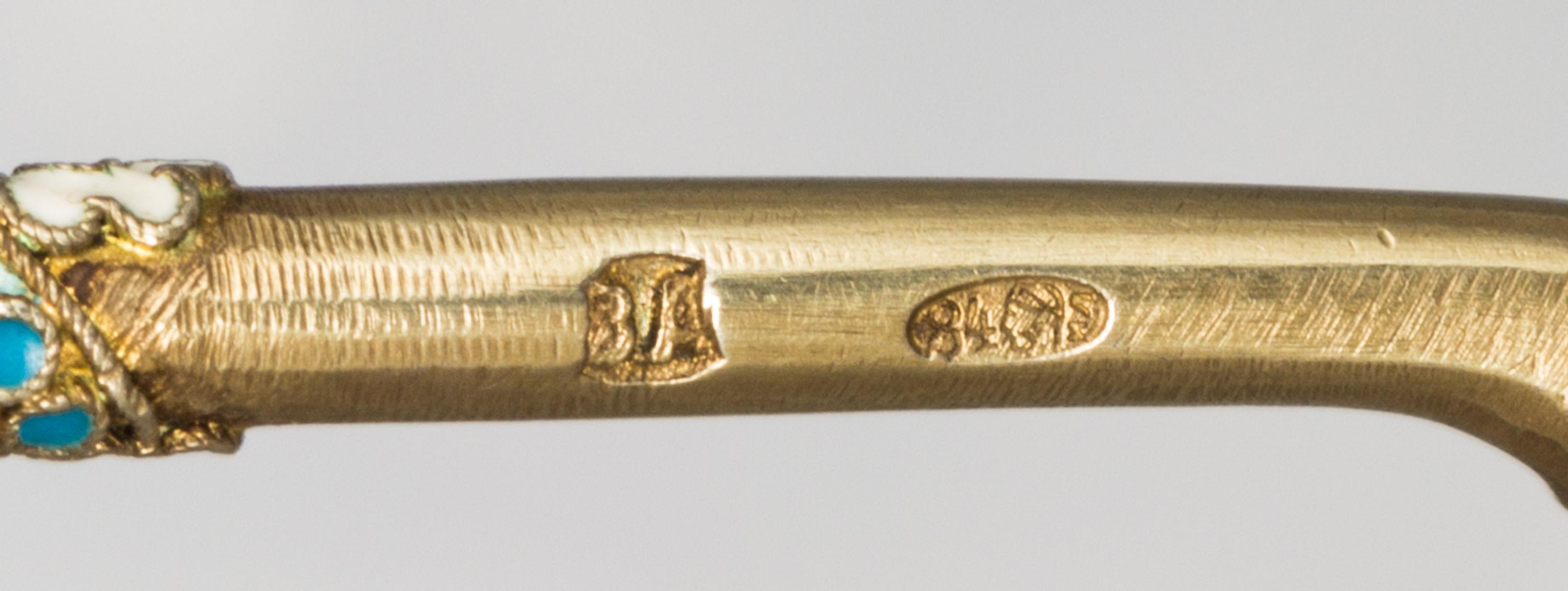 A Russian Silver-Gilt and Enamel Spoon, Mark of Third Artel, Moscow, early 20th century, the underside of the bowl with a polychrome bi