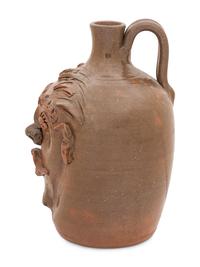 A Cole Pottery Glazed Stoneware Face Jug