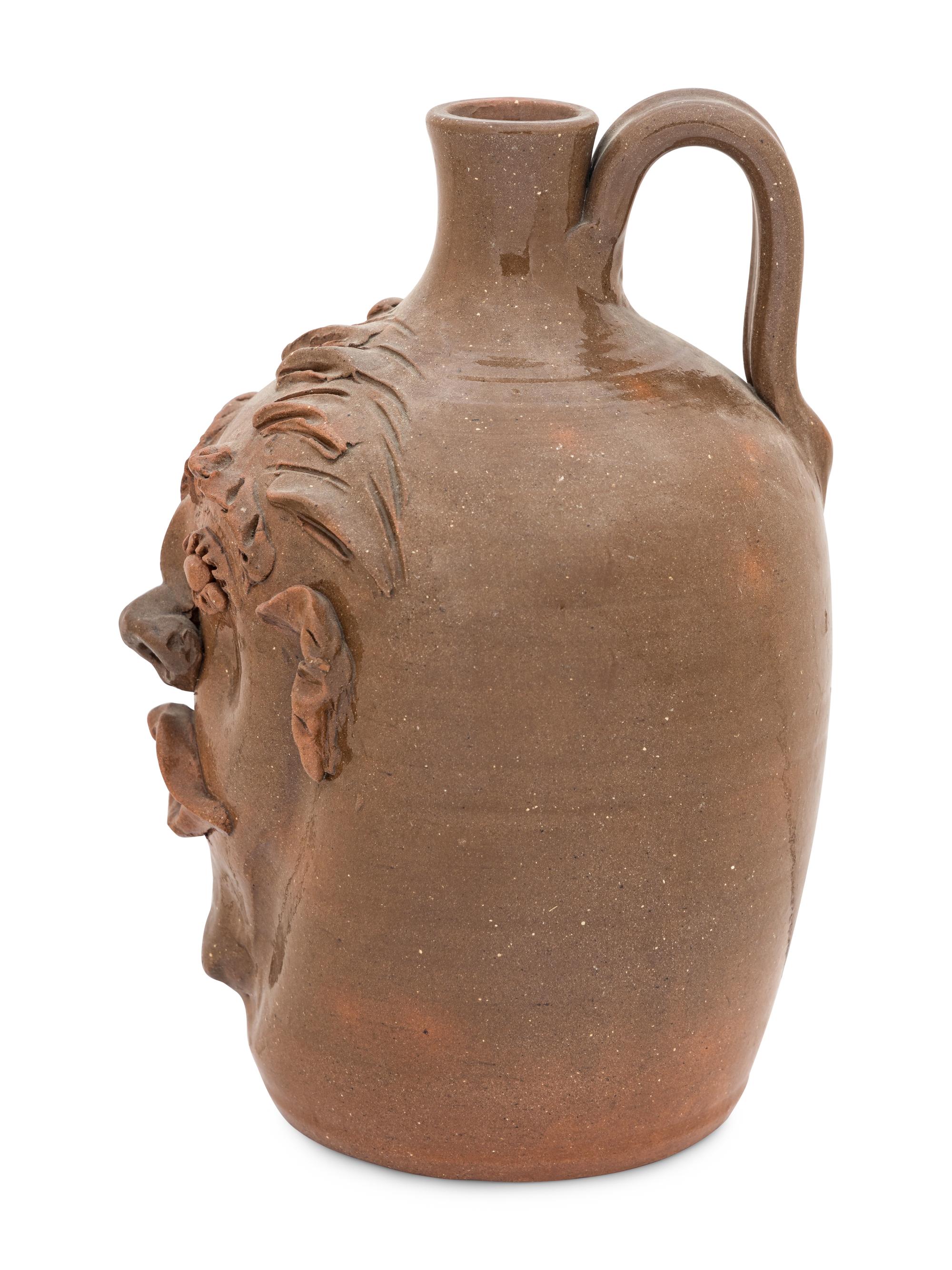 A Cole Pottery Glazed Stoneware Face Jug