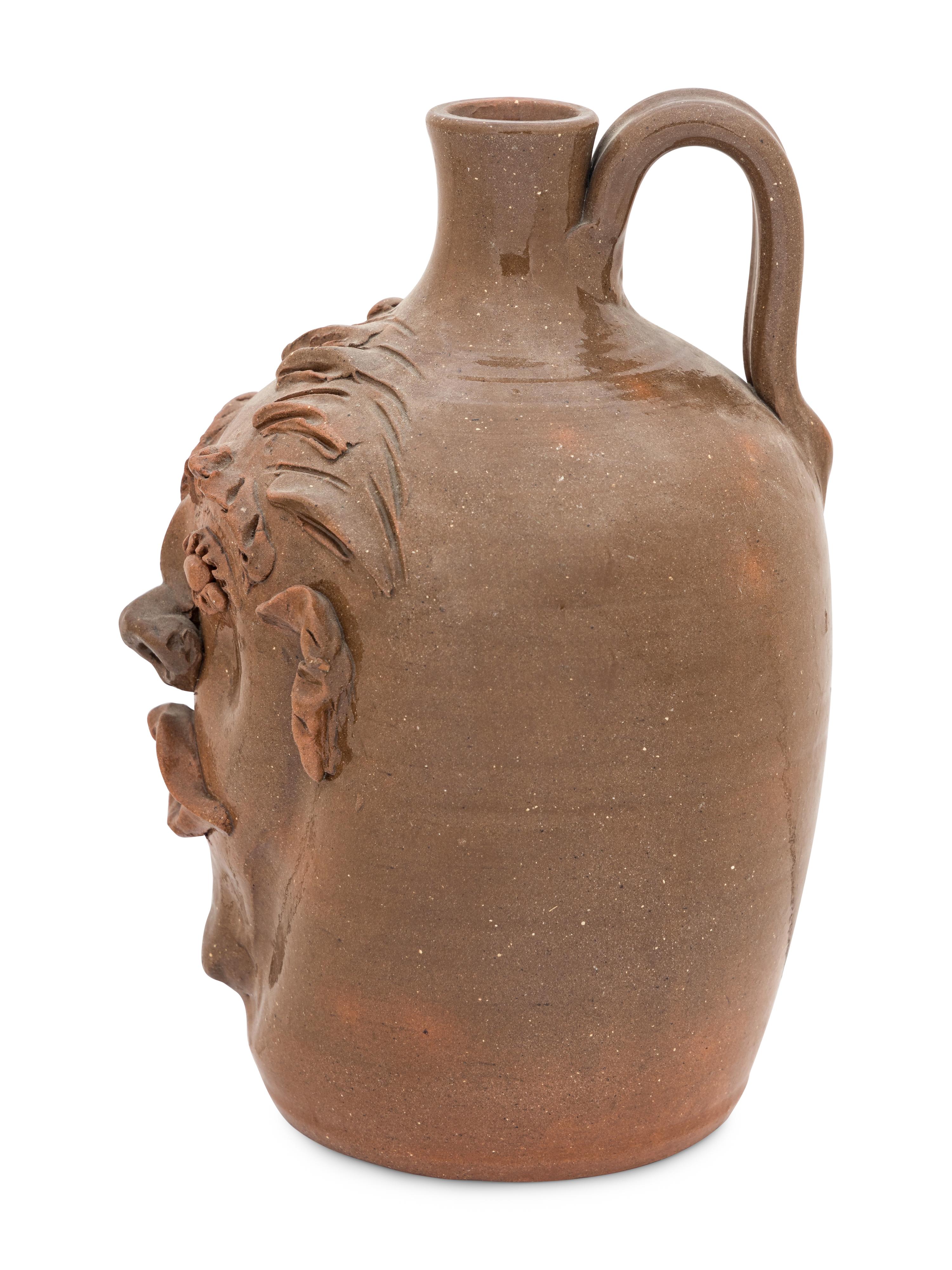 A Cole Pottery Glazed Stoneware Face Jug