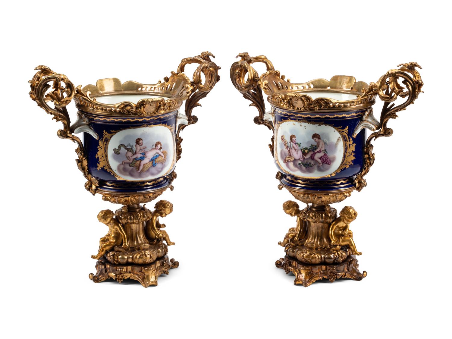 A Pair of Gilt Bronze Mounted Sèvres Style Porcelain Cache Pots
