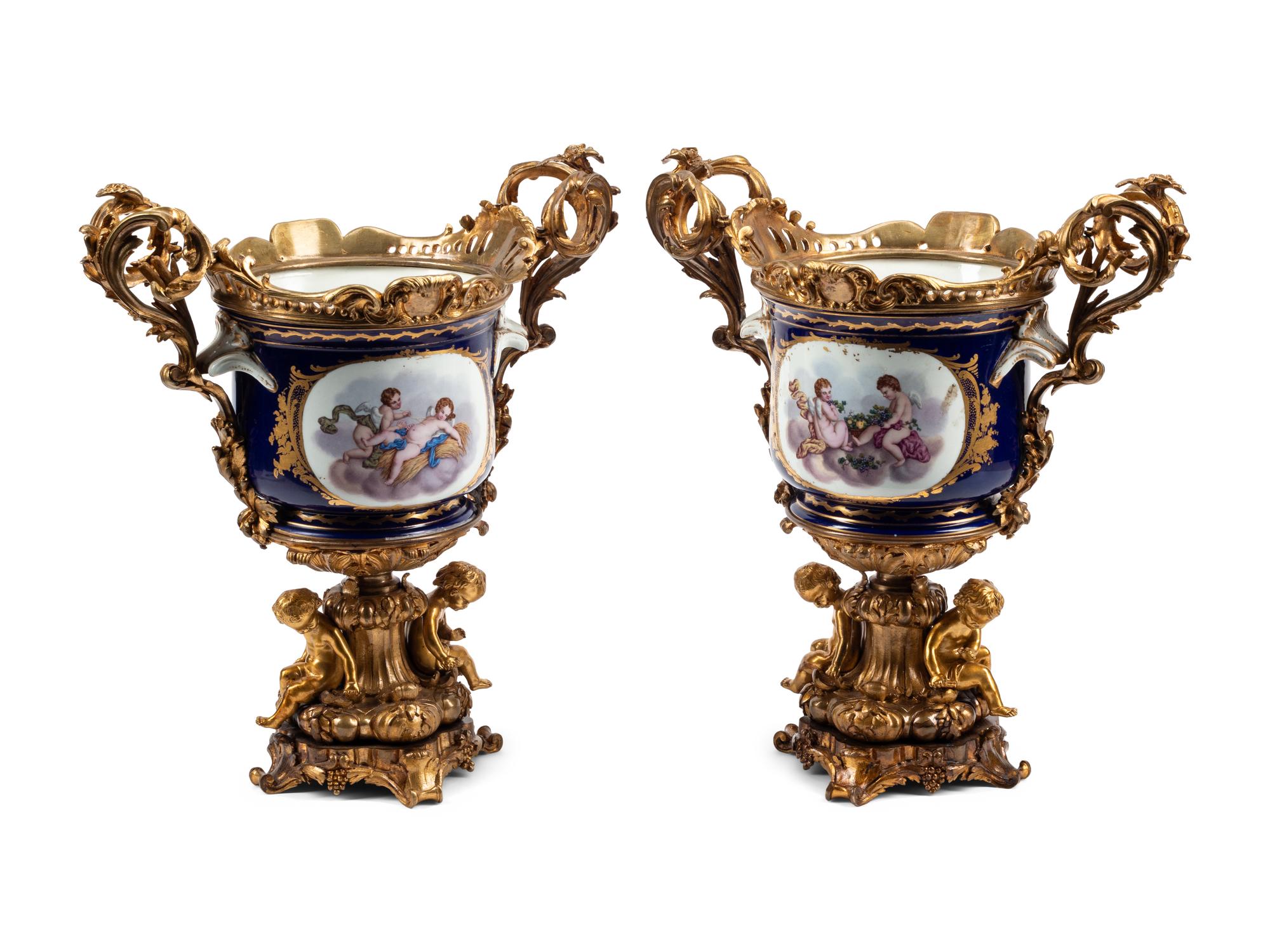A Pair of Gilt Bronze Mounted Sèvres Style Porcelain Cache Pots