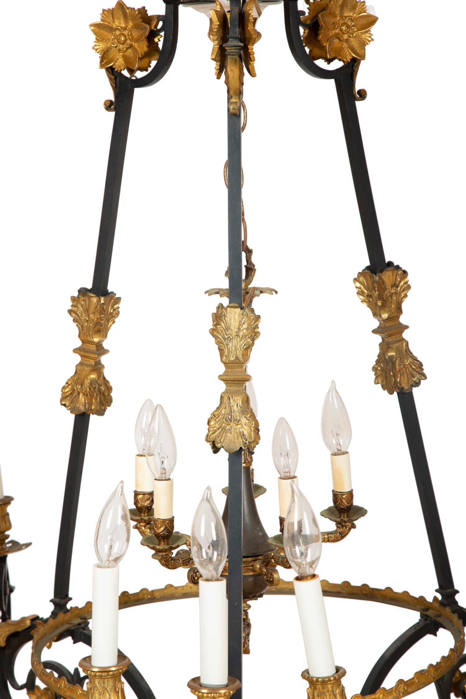 A French Empire Style Ebonized and Gilt Metal Fourteen-Light Chandelier