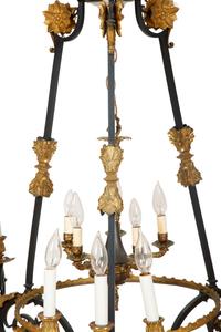 A French Empire Style Ebonized and Gilt Metal Fourteen-Light Chandelier