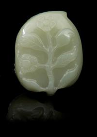 A Carved Jade Box and Cover Length 2 3/8 inches.