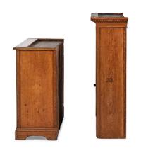 A Folk Art Carved and Paneled Pine Step-Back Cupboard