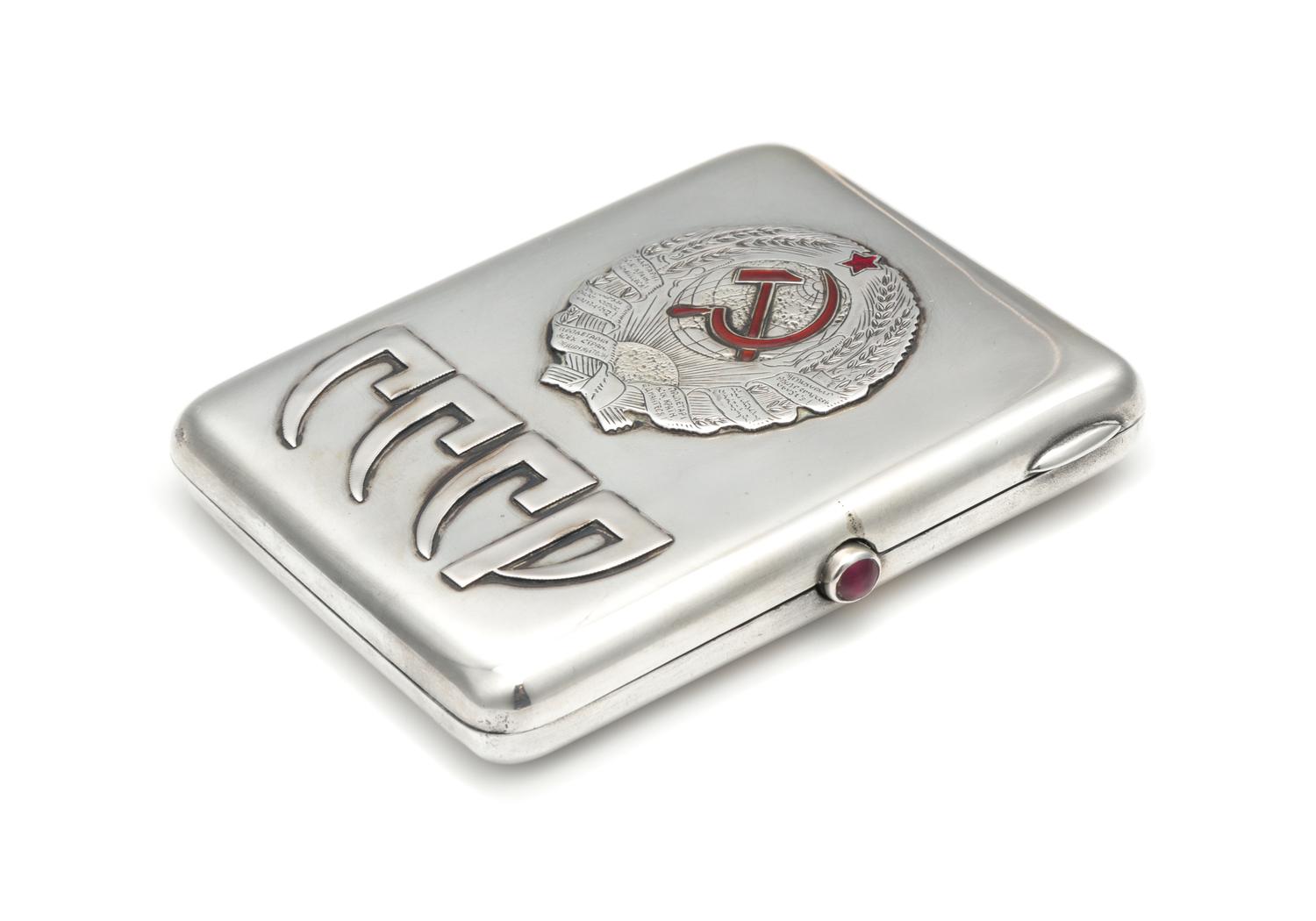 A Soviet-Era Russian Silver Cigarette Case, Maker's Mark Obscured, Moscow, Early to Mid-20th Century, the lid worked to show symbols of