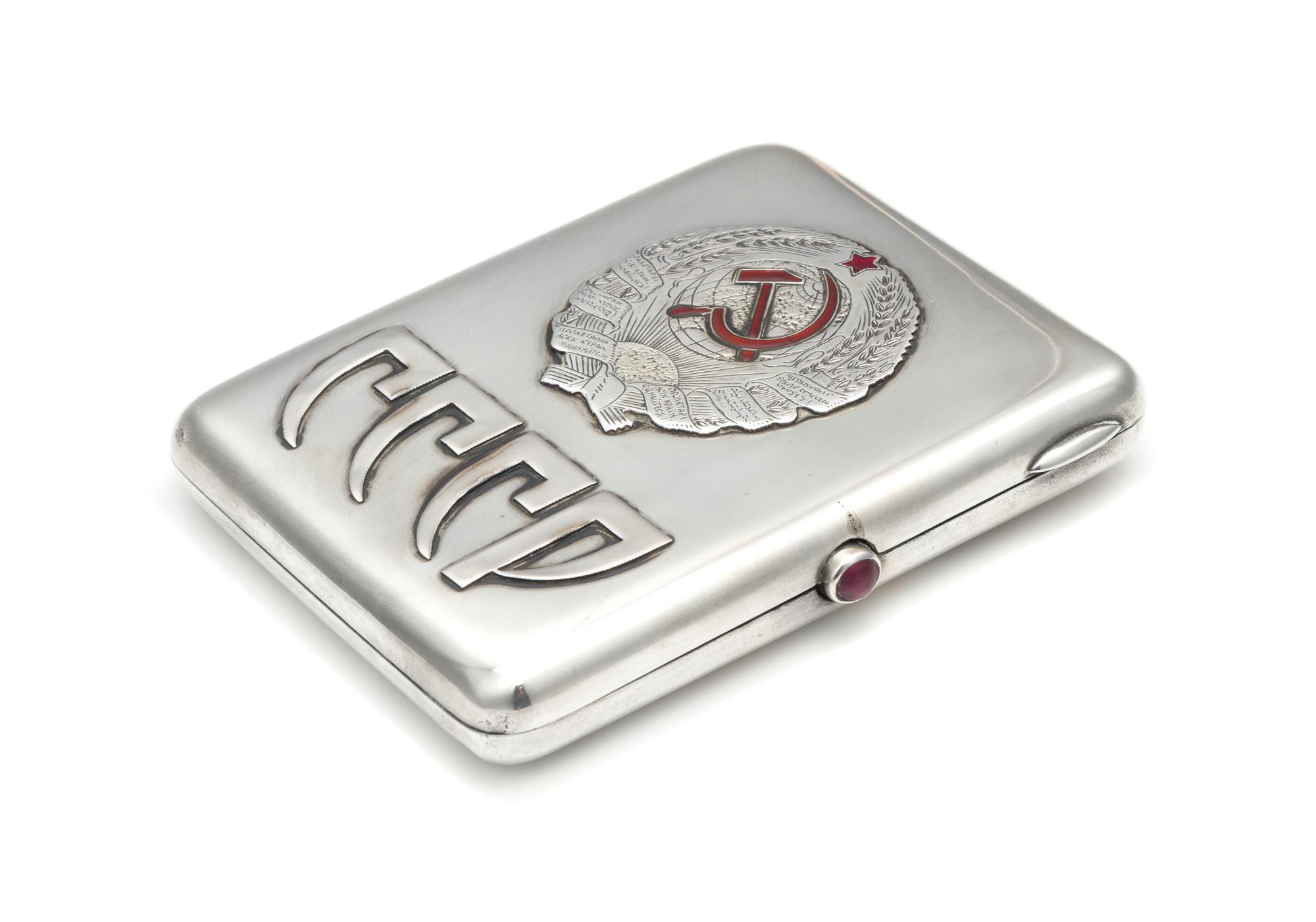 A Soviet-Era Russian Silver Cigarette Case, Maker's Mark Obscured, Moscow, Early to Mid-20th Century, the lid worked to show symbols of