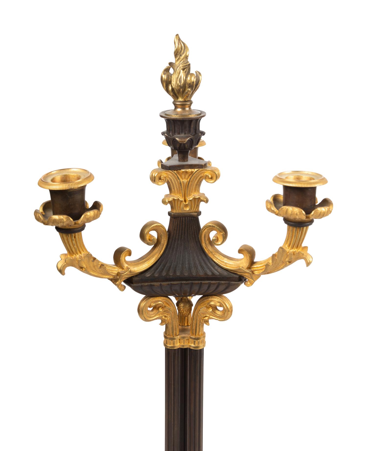 A Pair of Louis Philippe Style Gilt and Patinated Bronze Three-Light Candelabra