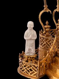 A Louis XV Style Gilt Bronze and Chinese Porcelain Mounted Pagoda-Form Mantel Clock
