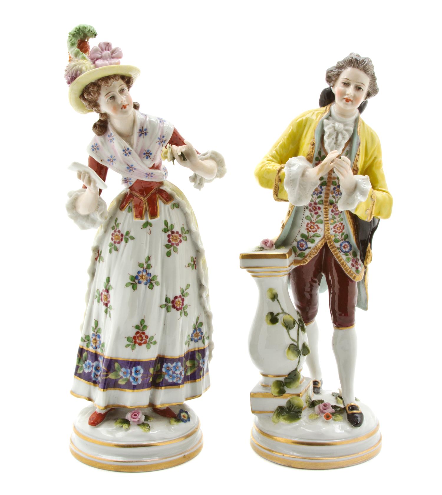 A Pair of Continental Porcelain Figures, Height 8 inches.