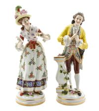 A Pair of Continental Porcelain Figures, Height 8 inches.