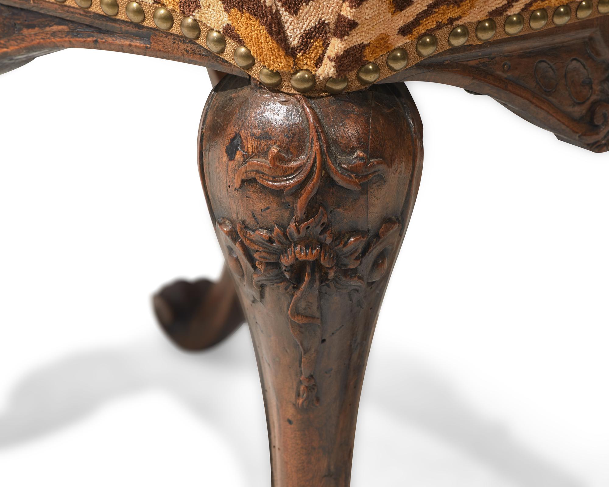 A small Portuguese Rococo carved walnut stool, 18th century