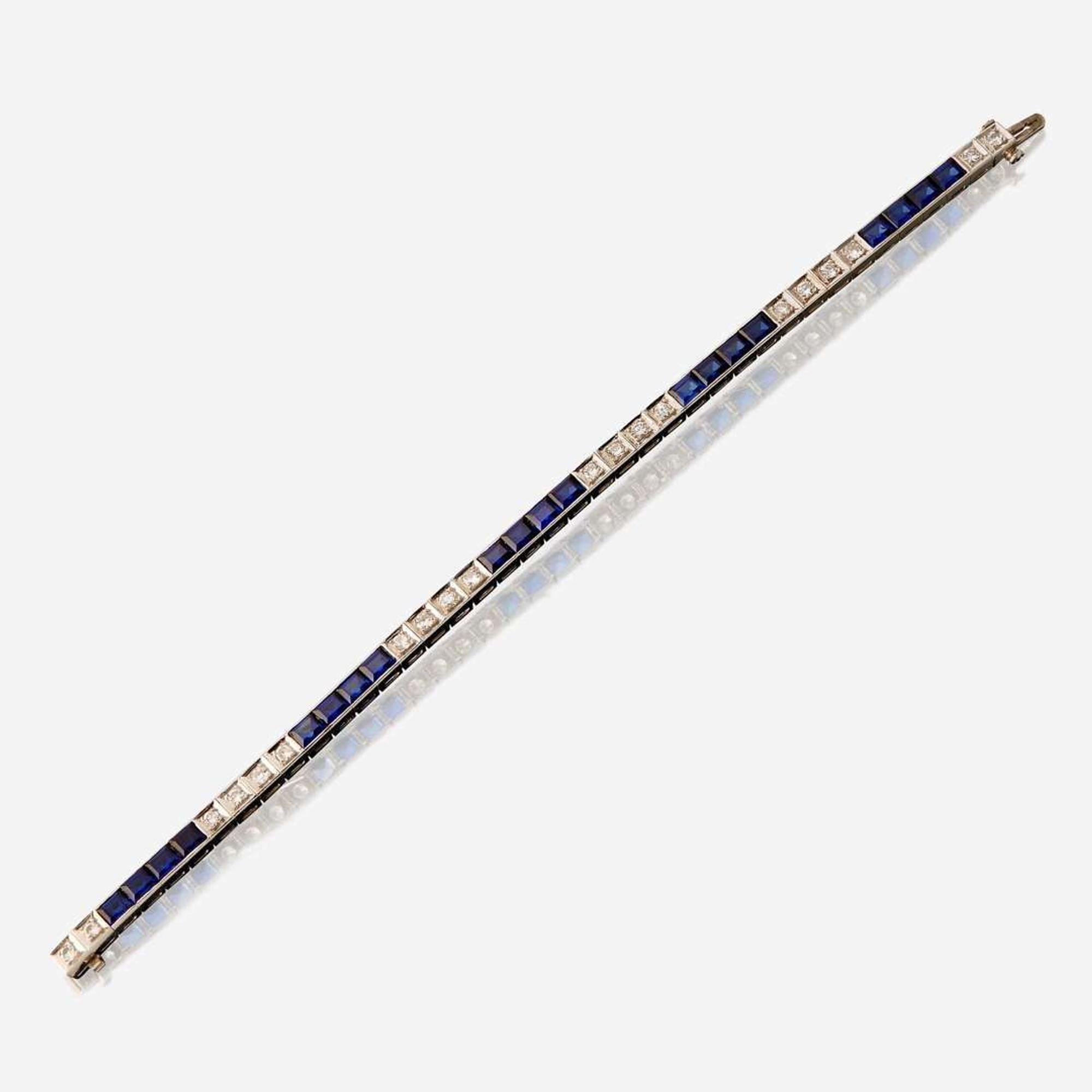 A fourteen karat white gold, synthetic sapphire, and diamond bracelet