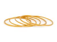COLLECTION OF YELLOW GOLD BANGLE BRACELETS