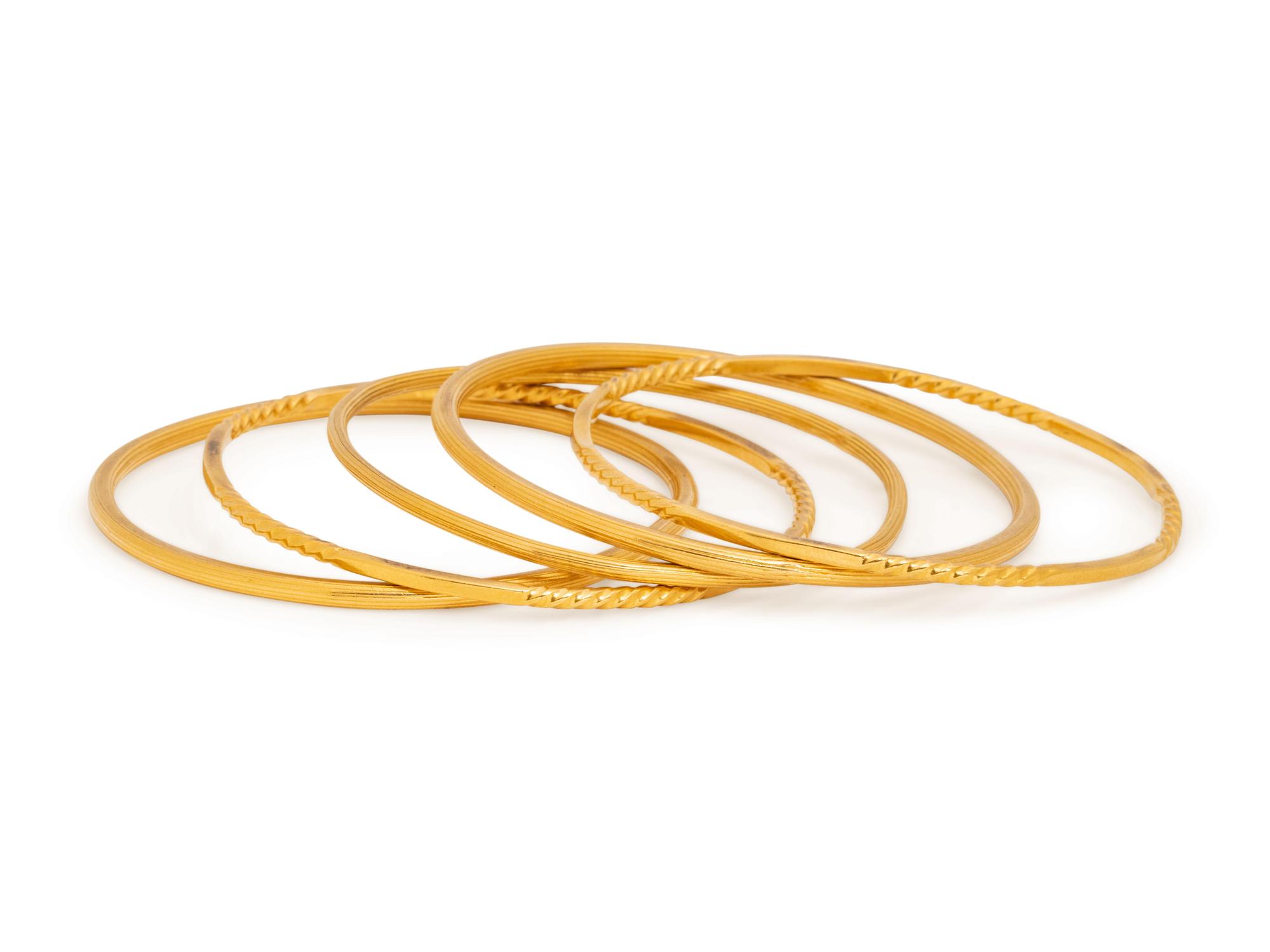 COLLECTION OF YELLOW GOLD BANGLE BRACELETS
