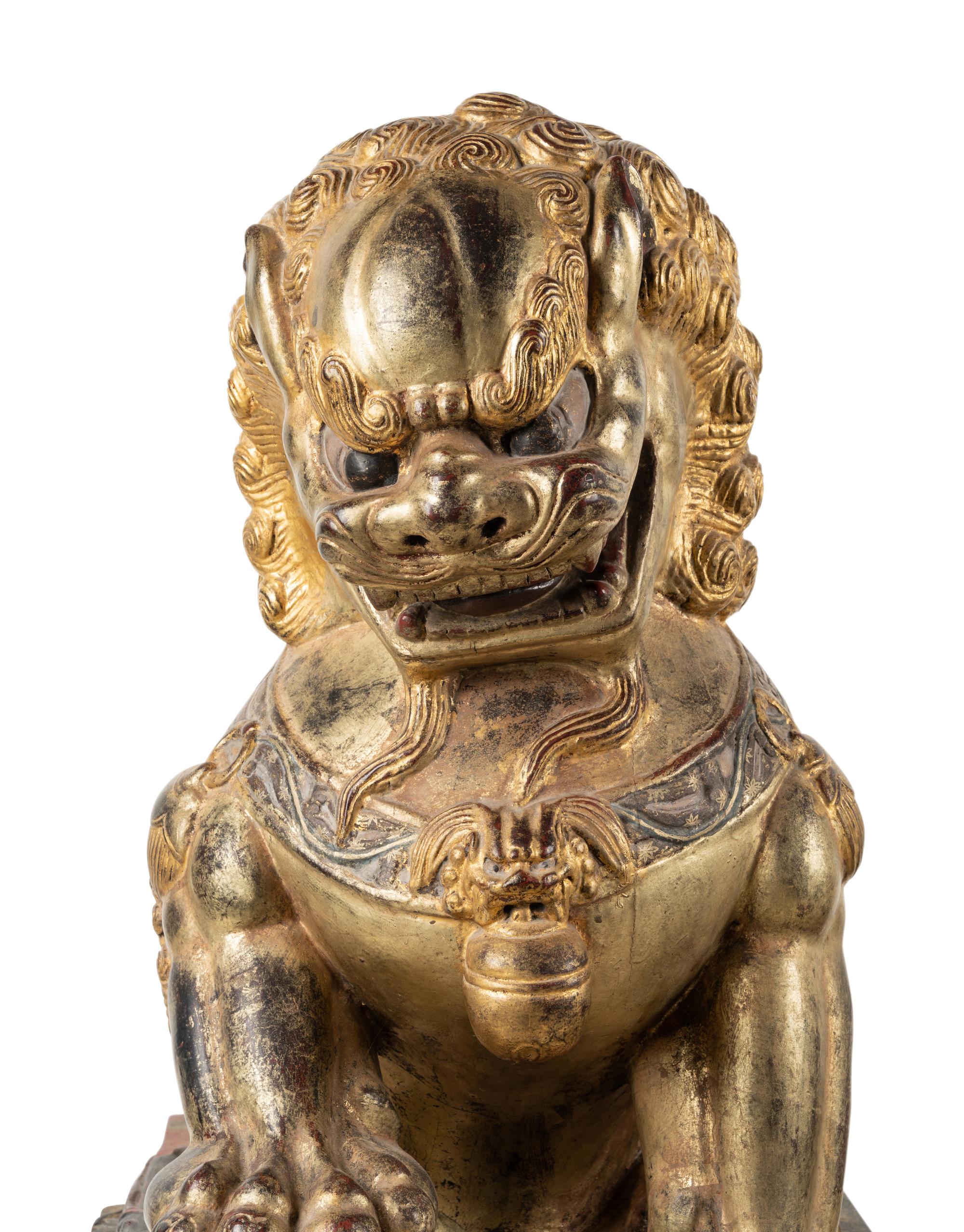 A Pair of Large Chinese Giltwood and Composition Buddhistic Lions