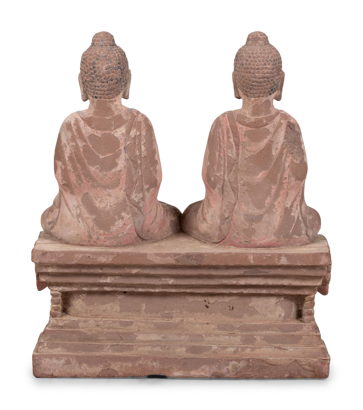 Two Chinese Carved Stone Seated Figures on a Rectangular Base with Remnants of Polychrome Decoration