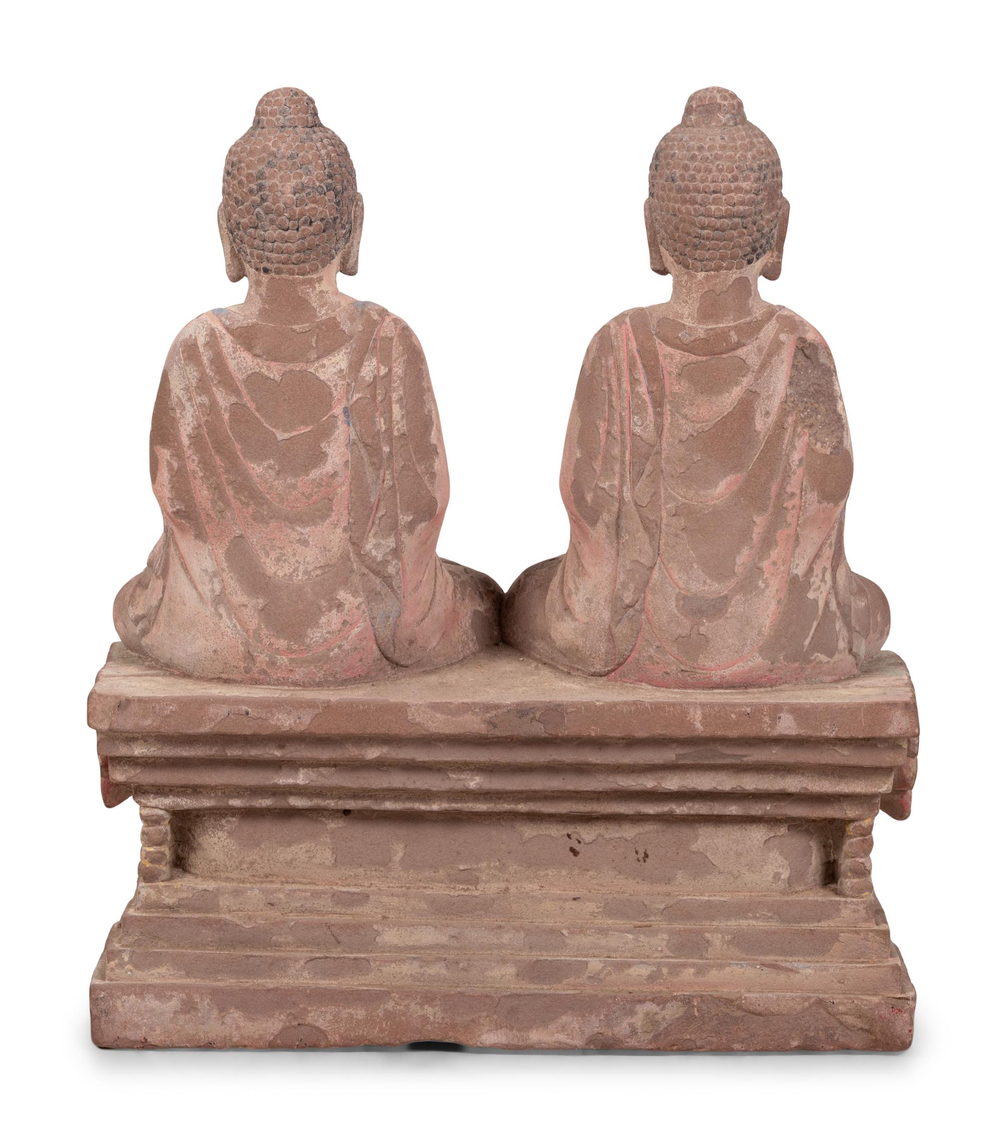 Two Chinese Carved Stone Seated Figures on a Rectangular Base with Remnants of Polychrome Decoration