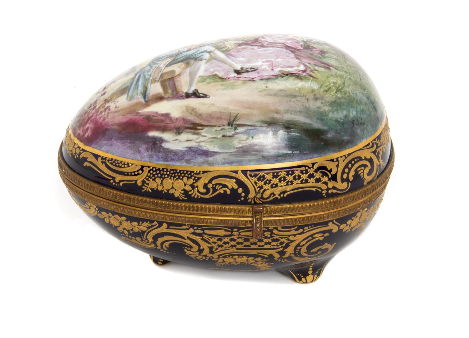 A Sevres Style Porcelain Table Casket, Height 6 3/4 x width 8 1/2 inches.