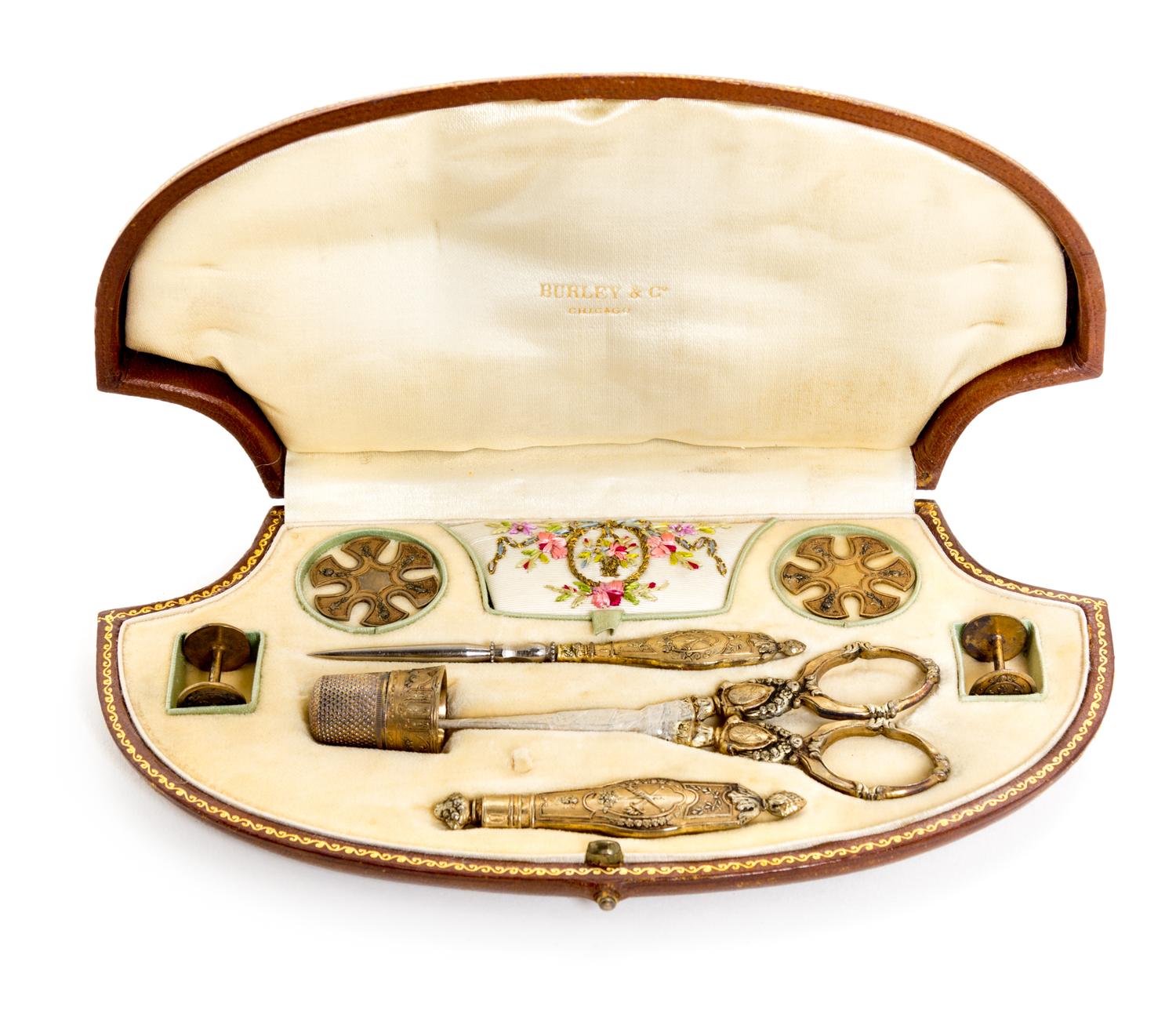 A Victorian Gilt Metal Sewing Kit Width of case 7 3/4 inches. — RETAILED BY BURLEY & CO., 19TH CENTURY