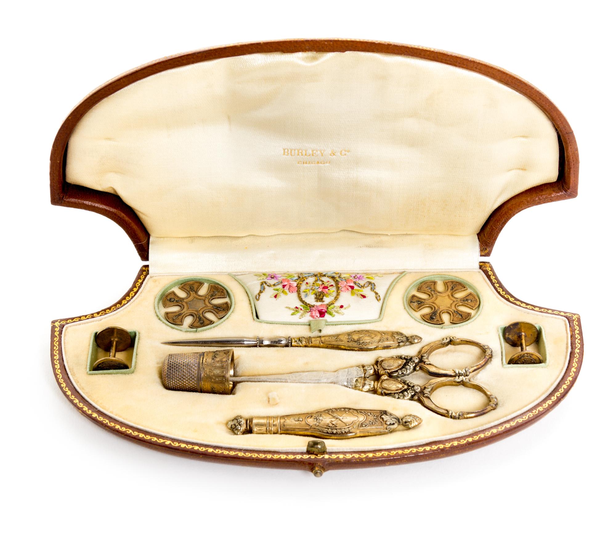 A Victorian Gilt Metal Sewing Kit Width of case 7 3/4 inches. — RETAILED BY BURLEY & CO., 19TH CENTURY