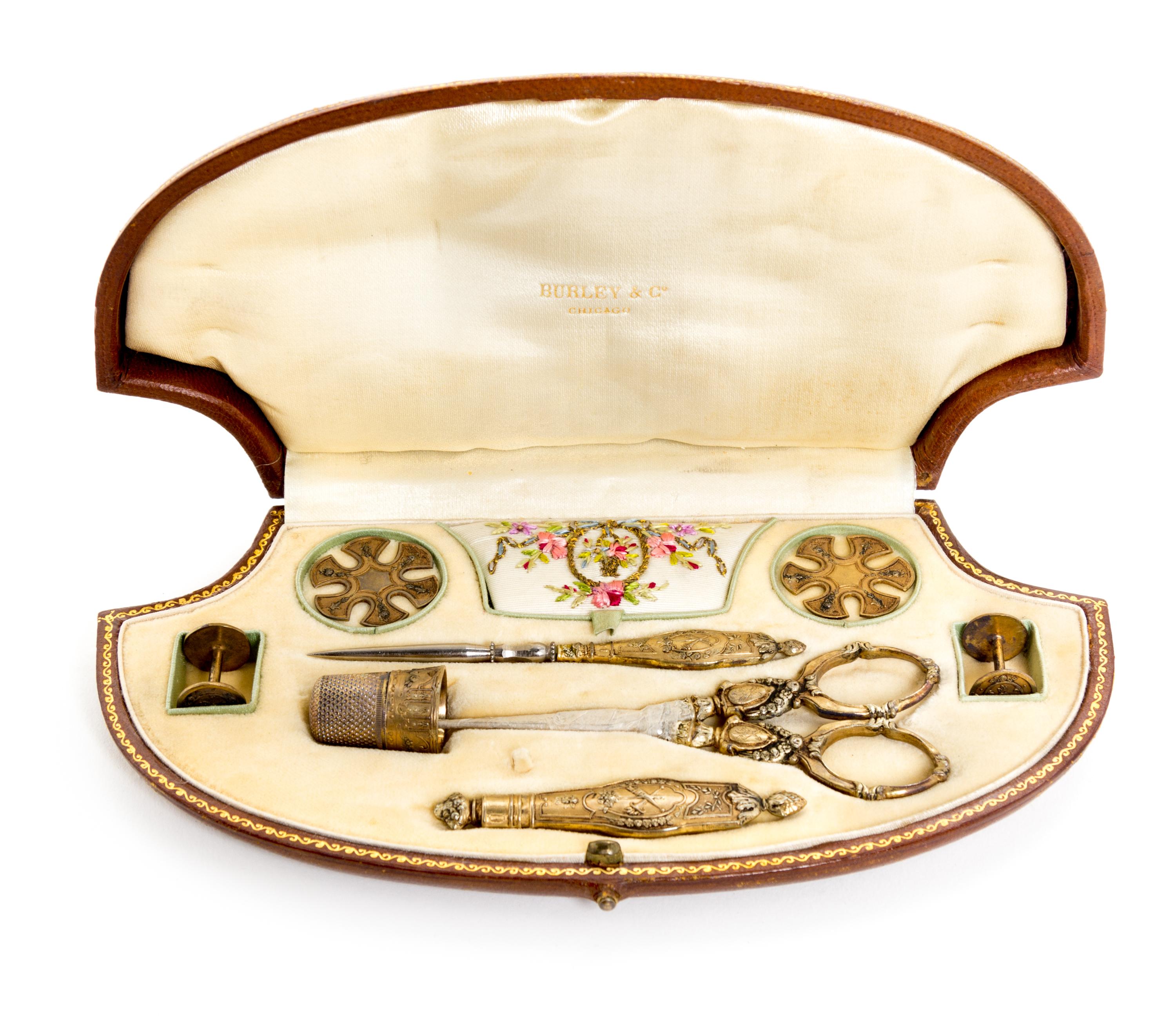 A Victorian Gilt Metal Sewing Kit Width of case 7 3/4 inches. — RETAILED BY BURLEY & CO., 19TH CENTURY