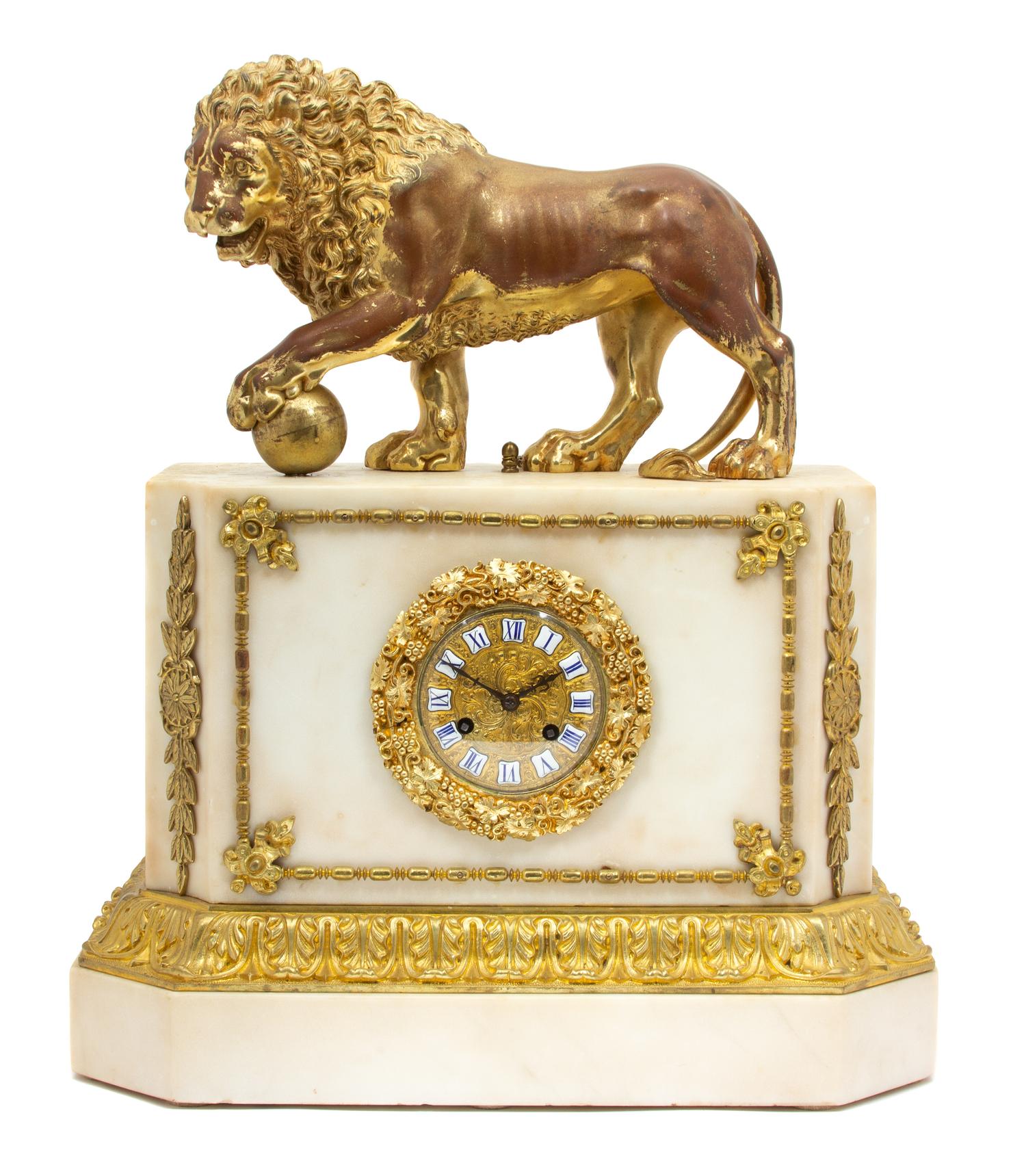 An Empire Style Gilt Bronze Mounted White Marble Clock Height 21 1/2 x width 18 1/2 x depth 8 1/2 inches. — 19TH CENTURY