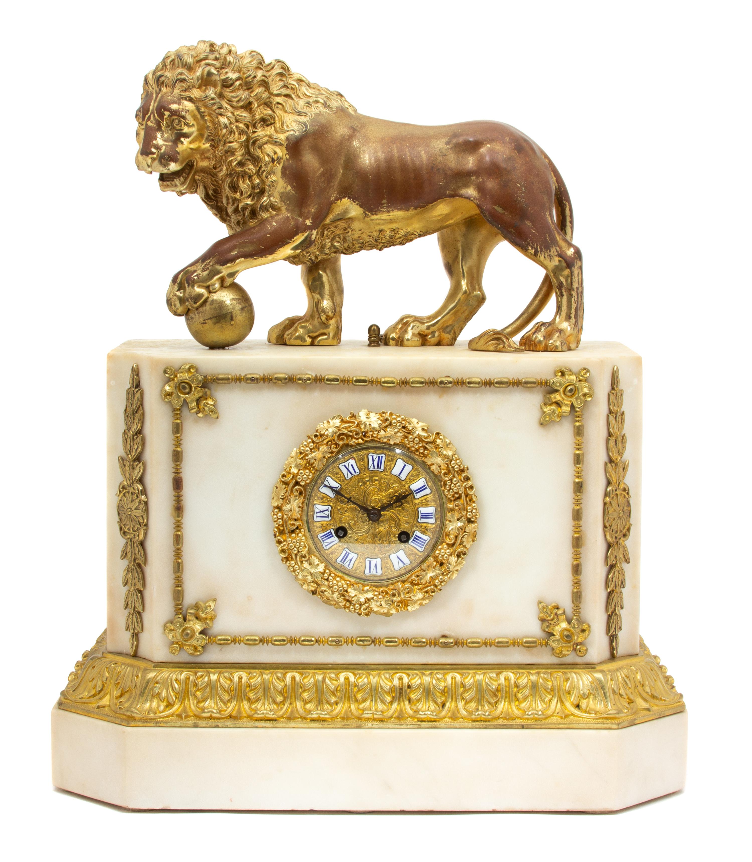 An Empire Style Gilt Bronze Mounted White Marble Clock Height 21 1/2 x width 18 1/2 x depth 8 1/2 inches. — 19TH CENTURY
