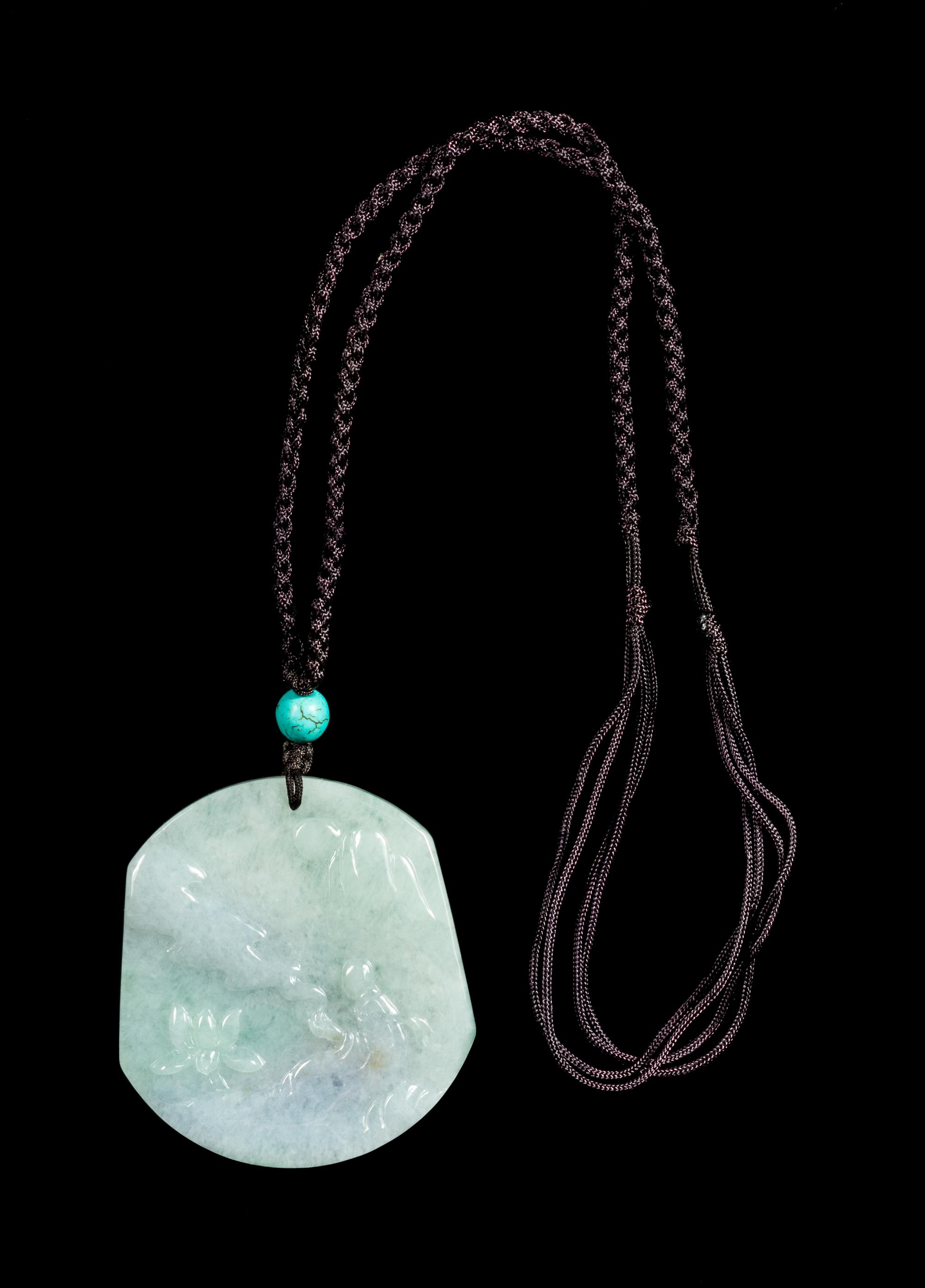A Lavender and Celadon Jadeite Pendant Length 2 1/8 inches. — 20TH CENTURY