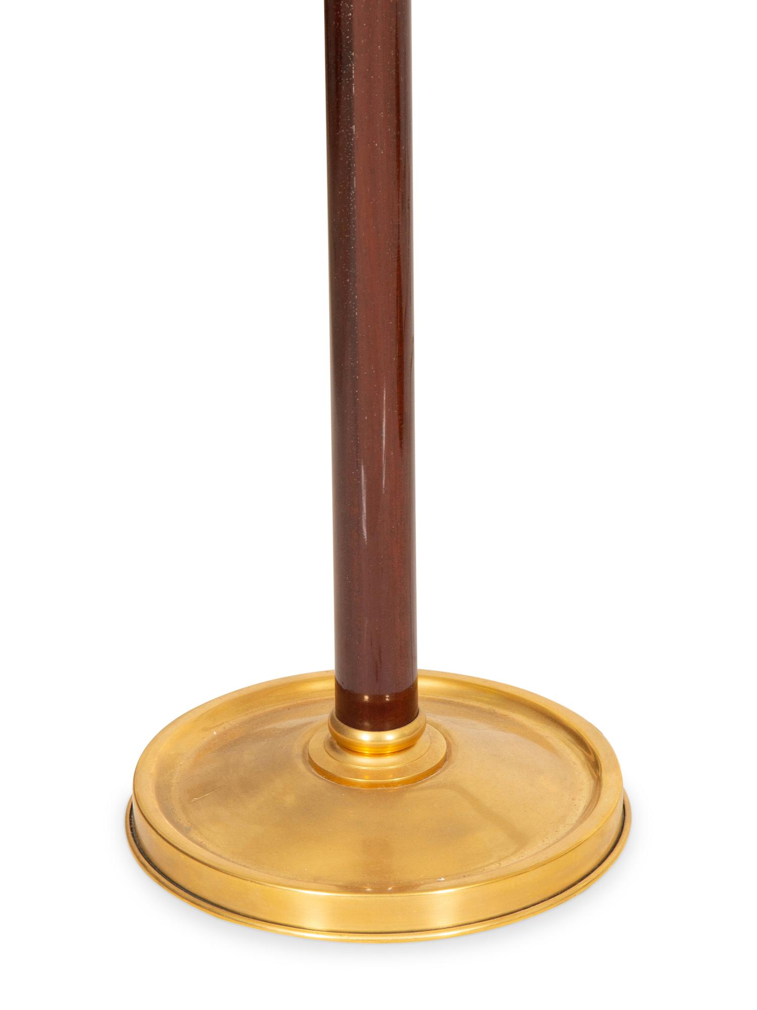 A Group of Four Brass Adjustable Floor Lamps