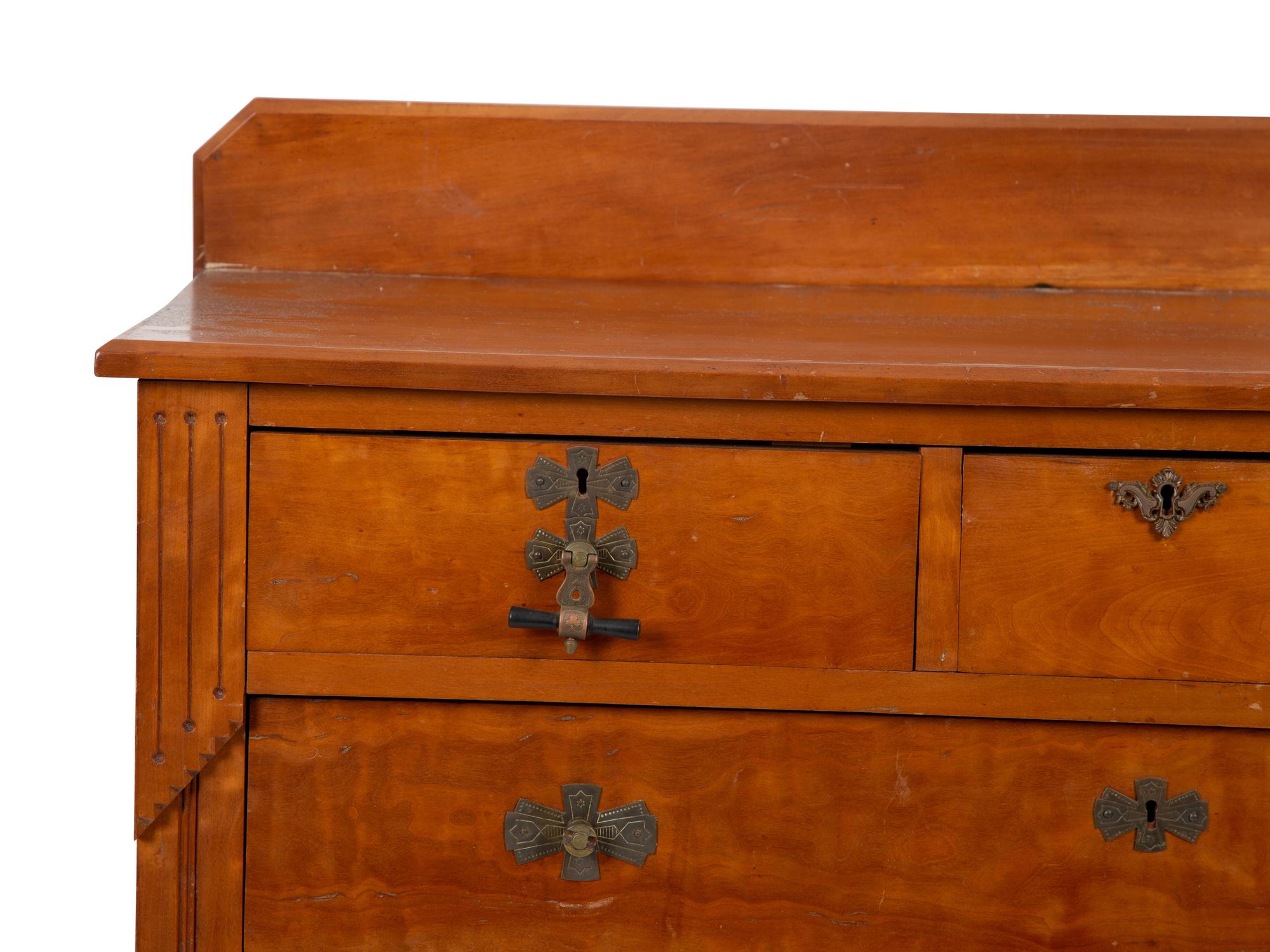 A Victorian Eastlake Aesthetic Flame Cherry Chest of Drawers — EARLY 20TH CENTURY