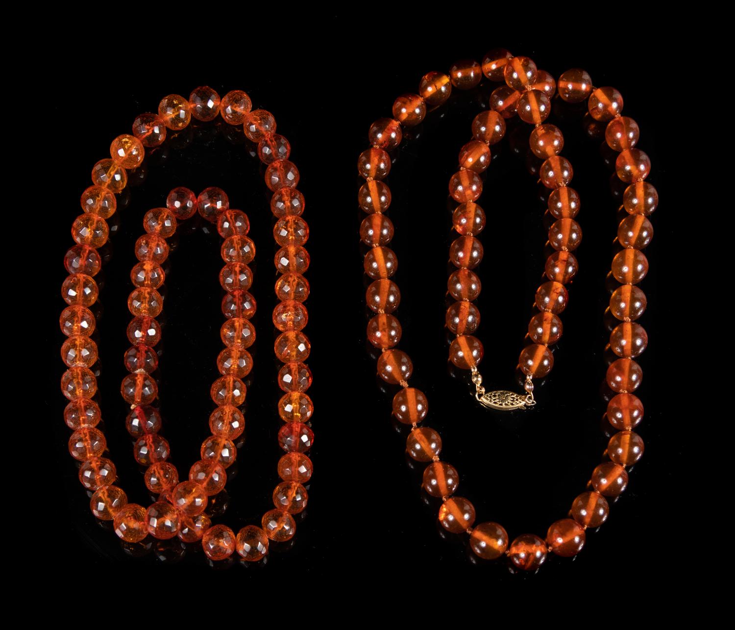 Two Amber Beaded Necklaces Length of longest 26 1/2 inches.