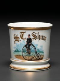A Porcelain Shaving Mug Depicting a High Wheelman