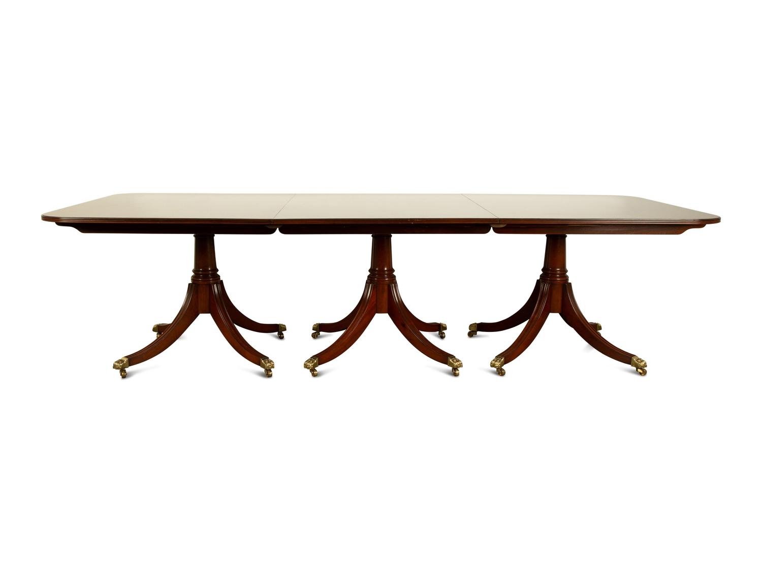 A Regency Style Mahogany Triple Pedestal Dining Table — 20TH CENTURY