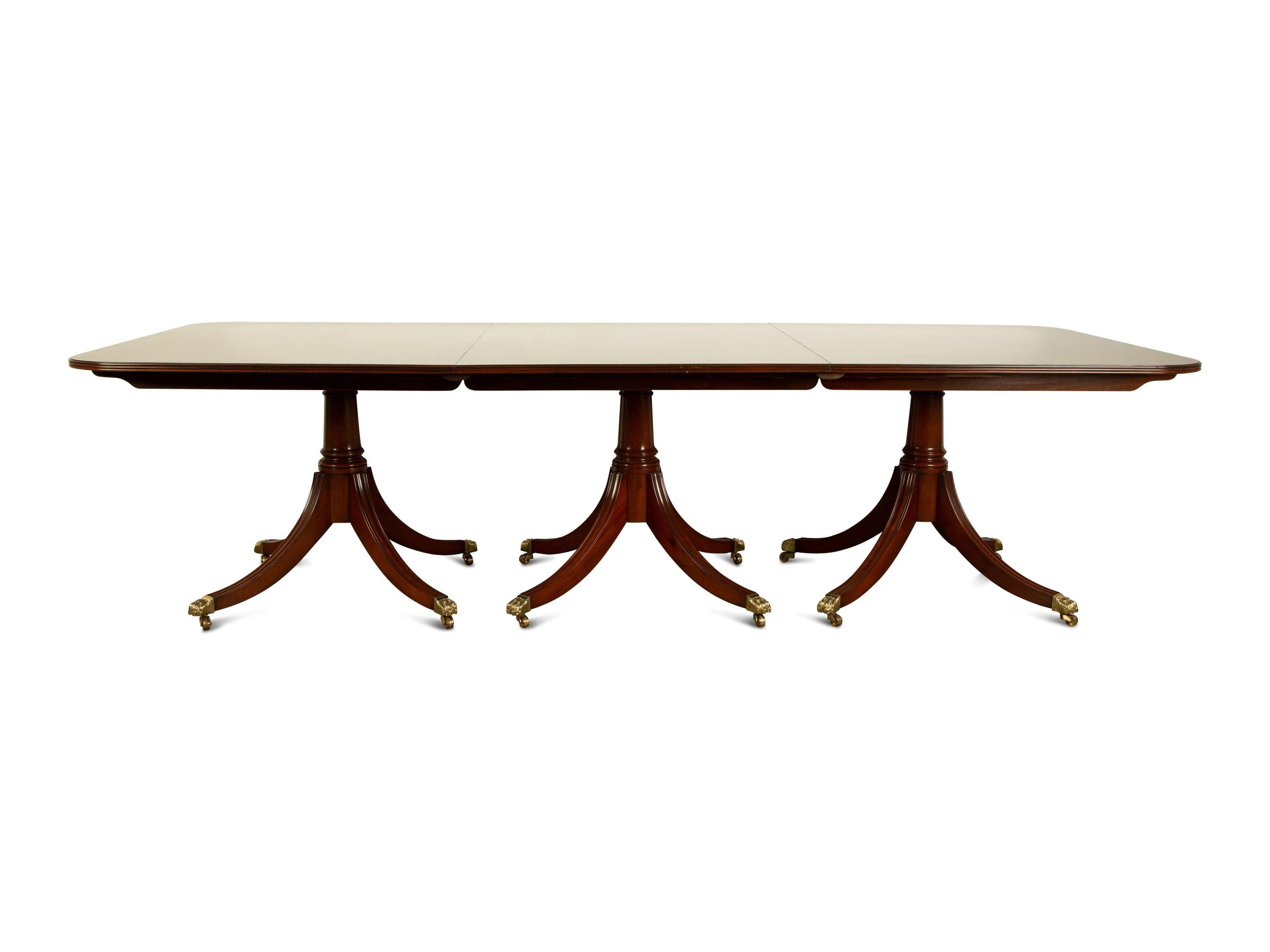 A Regency Style Mahogany Triple Pedestal Dining Table — 20TH CENTURY