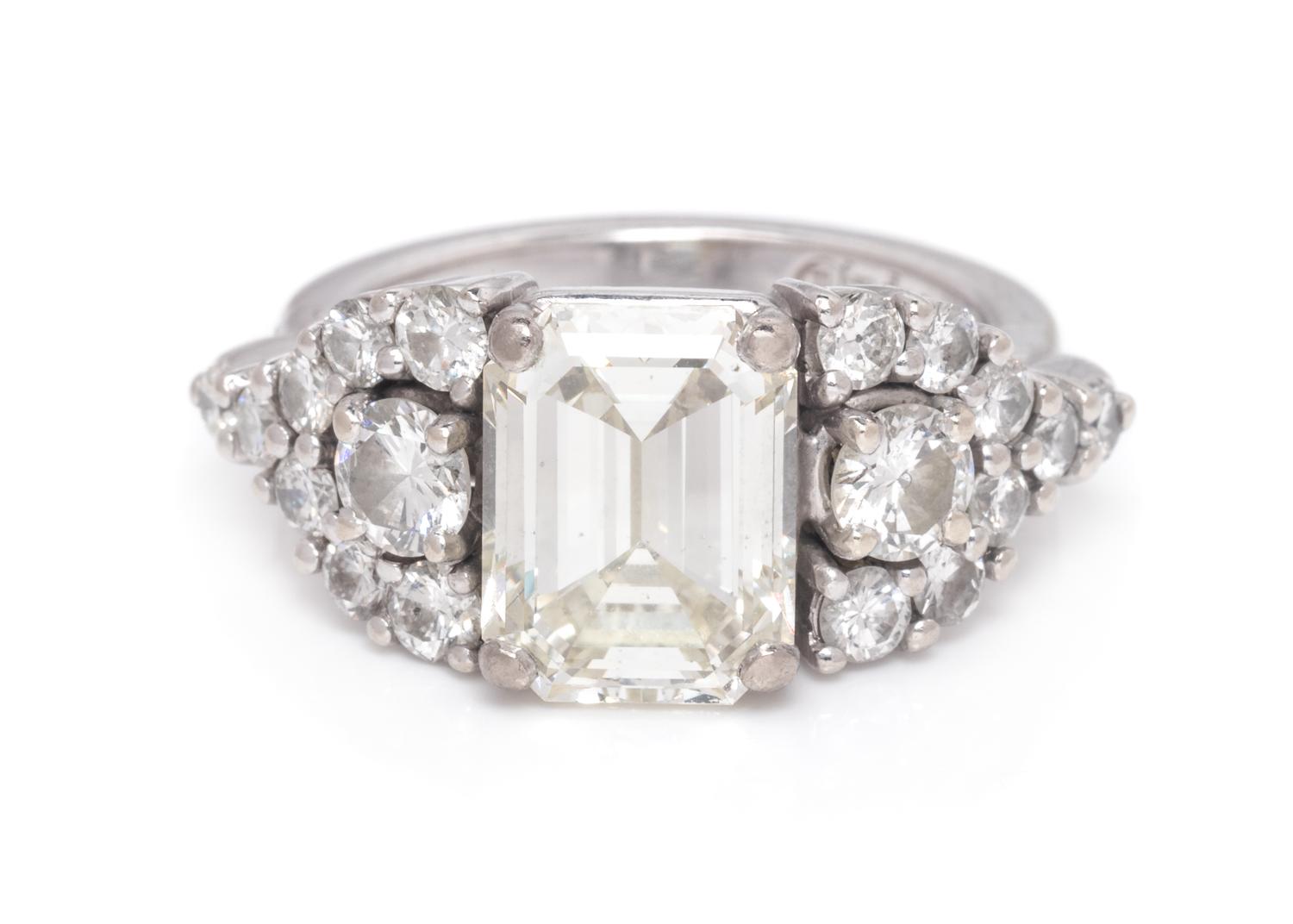 A 14 Karat White Gold and Diamond Ring,