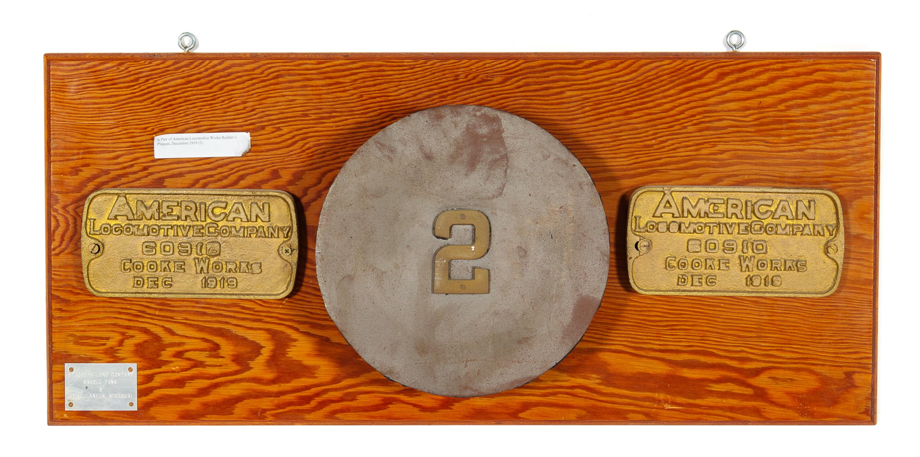 Two Painted Metal American Locomotive Company: Cooke Works Locomotive Badges for the St. Joseph Lead Company.