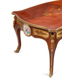 A Louis XV Style Gilt Bronze and Porcelain Mounted Marquetry Low Table