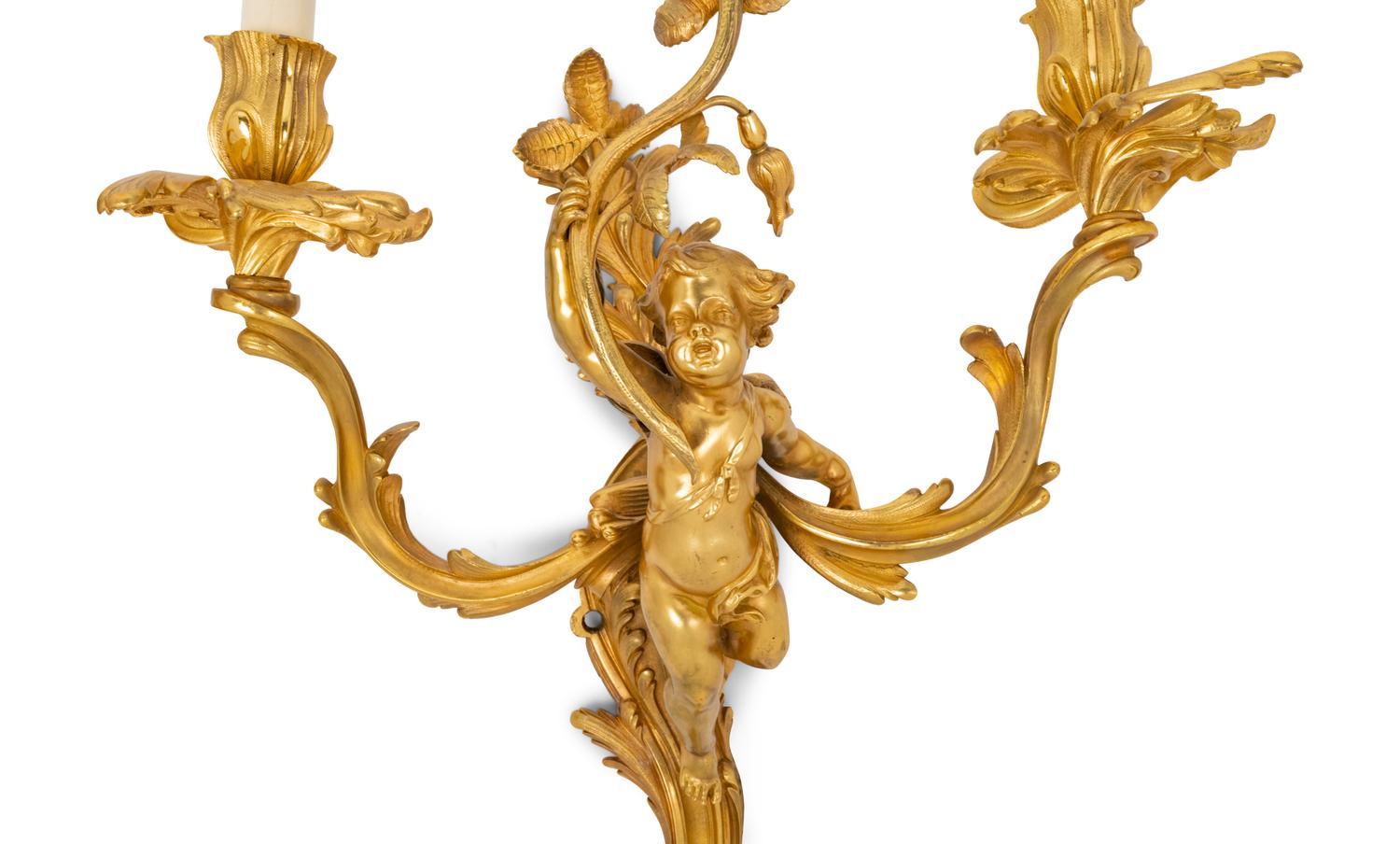 A Pair of Louis XV Style Gilt Bronze Figural Three-Light Sconces