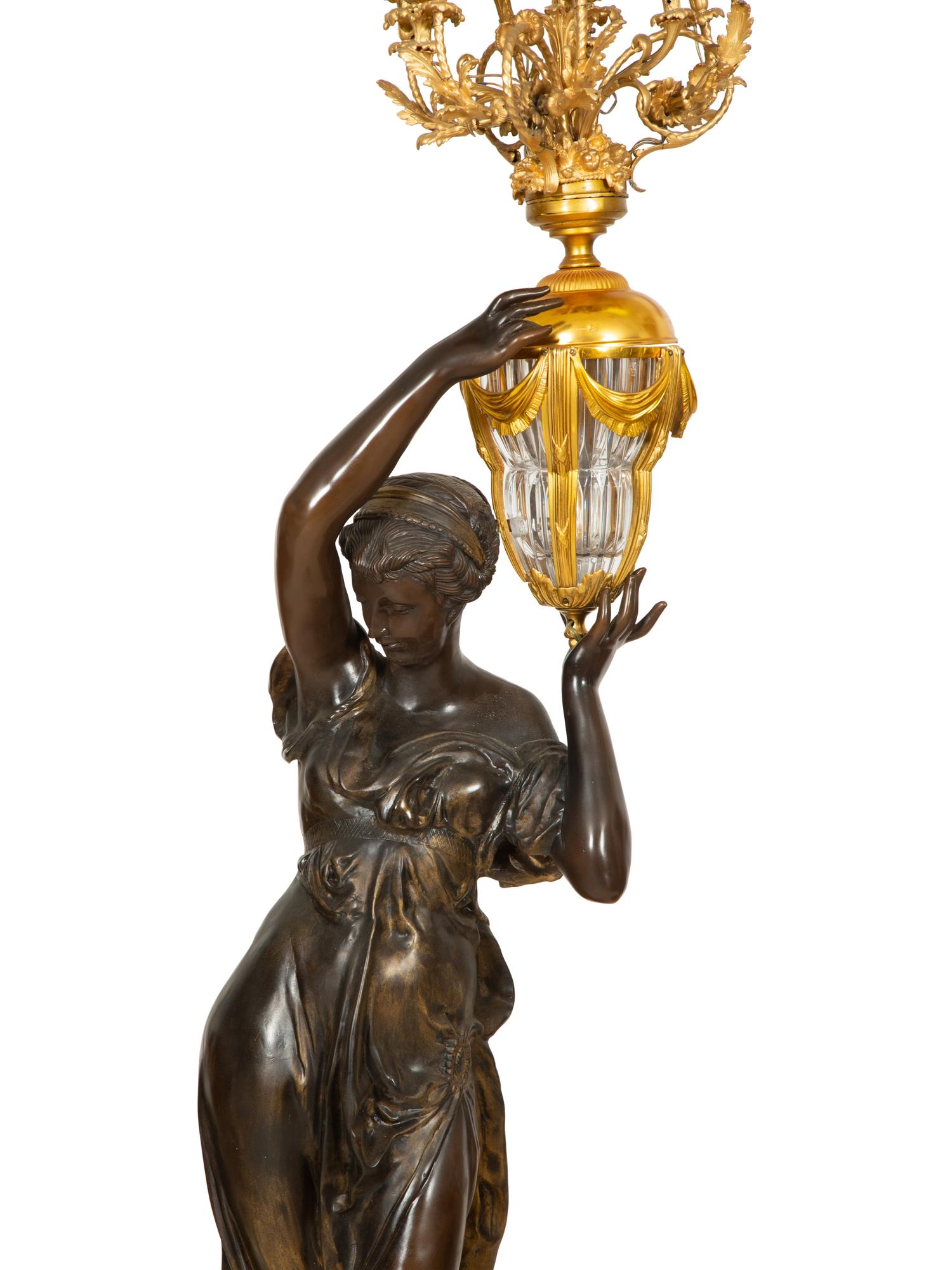 A Pair of French Gilt and Patinated Bronze Figural Nine-Light Torchères