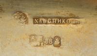 A Russian Enameled Silver Cigarette Case, Mark of Ivan Khlebnikov with imperial warrant, Moscow, 1882, the case worked with foliate and