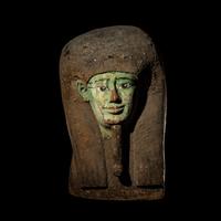 An Egyptian Painted Wood Sarcophagus Head