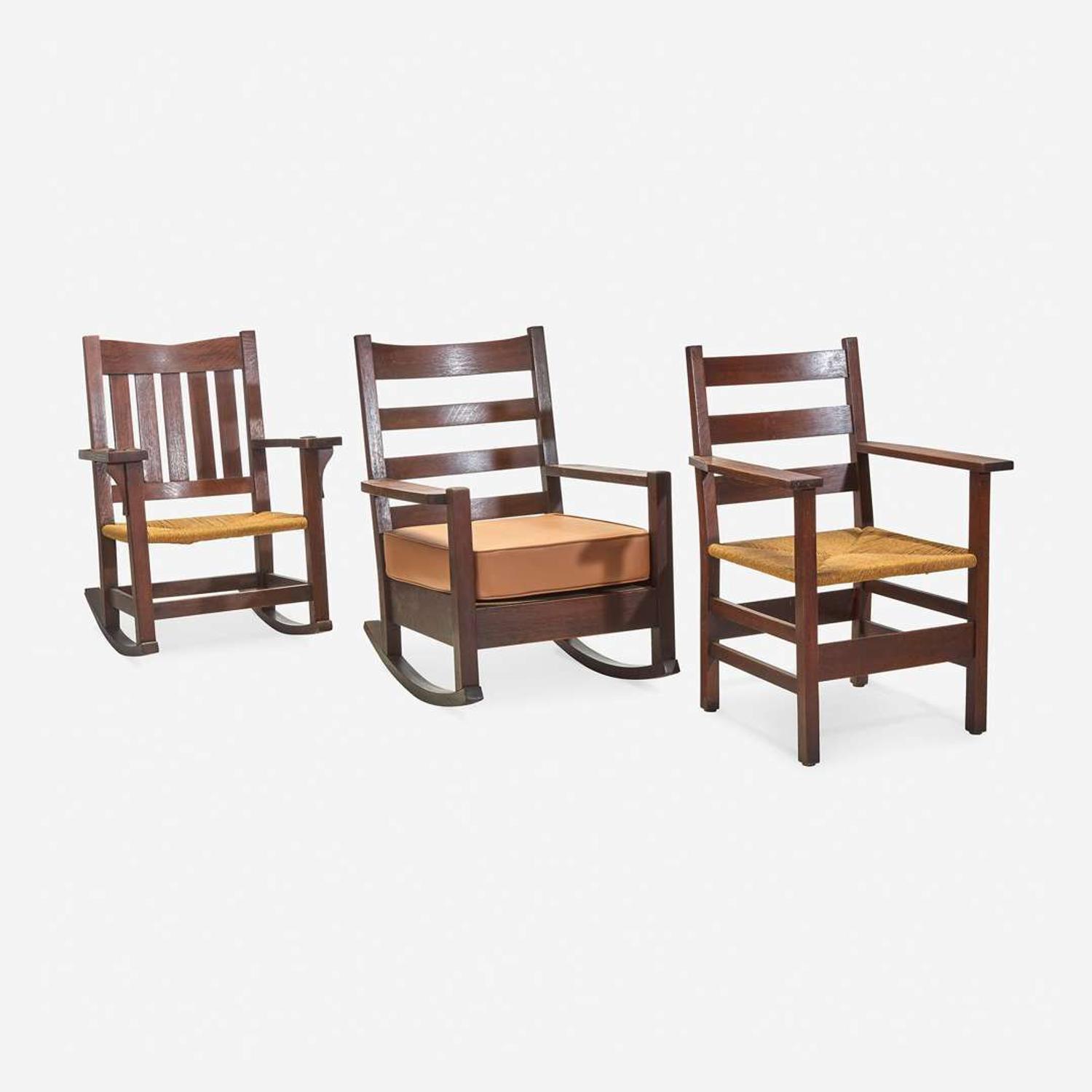 Gustav Stickley (American, 1858-1942) Three Chairs: Arm Rocker No. 2597, an Arm Rocker, and Armchair No. 2618-A, circa 1902