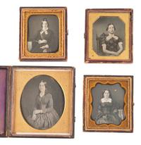 [EARLY PHOTOGRAPHY]. 20 daguerreotypes feat. women with gold accessories incl. example by PLUMBE.